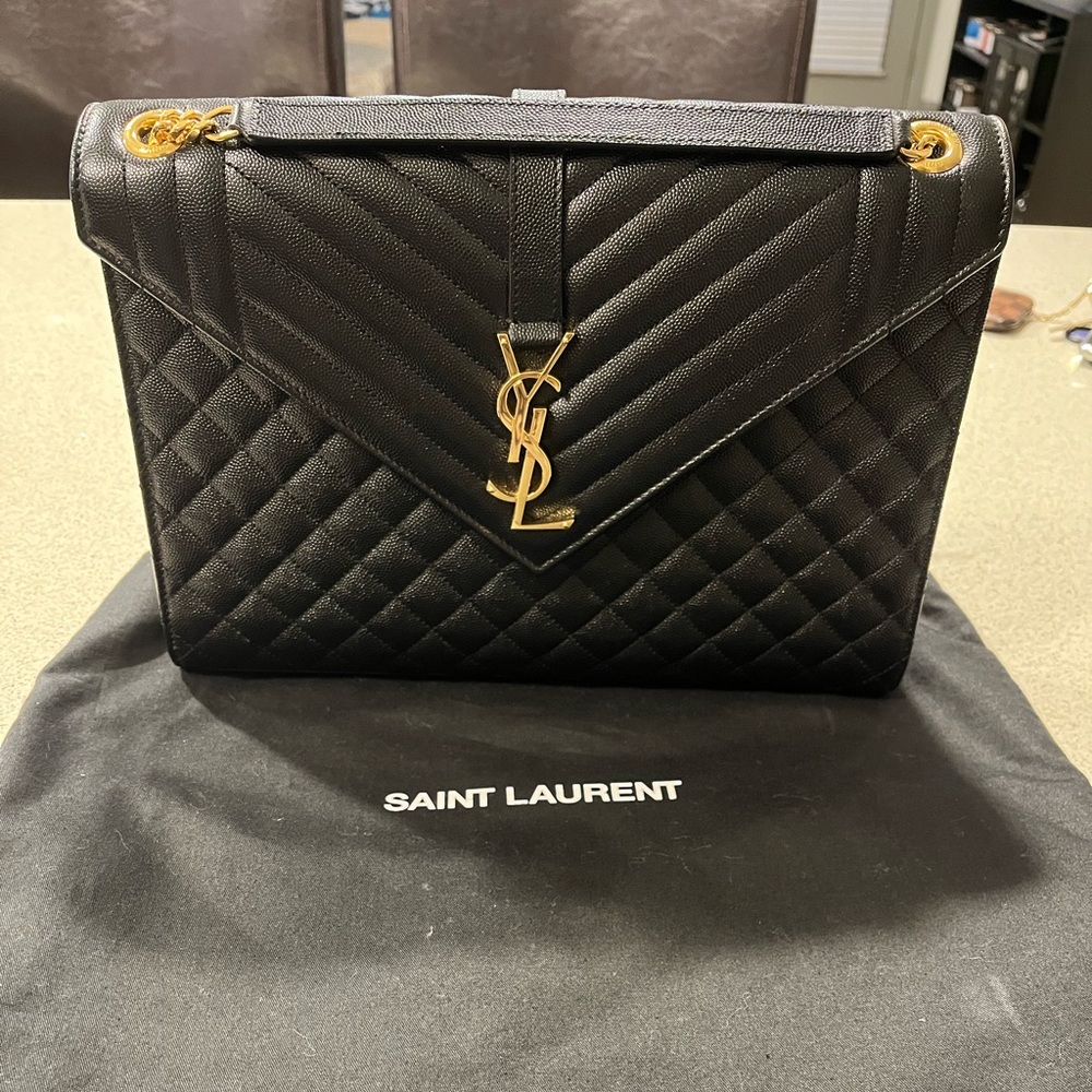 Barely used Large black YSL envelope bag with gold hardware.